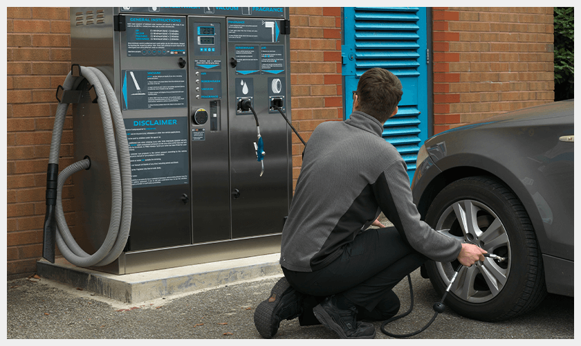 PCL - Man using air option on Multi-unit on a Forecourt